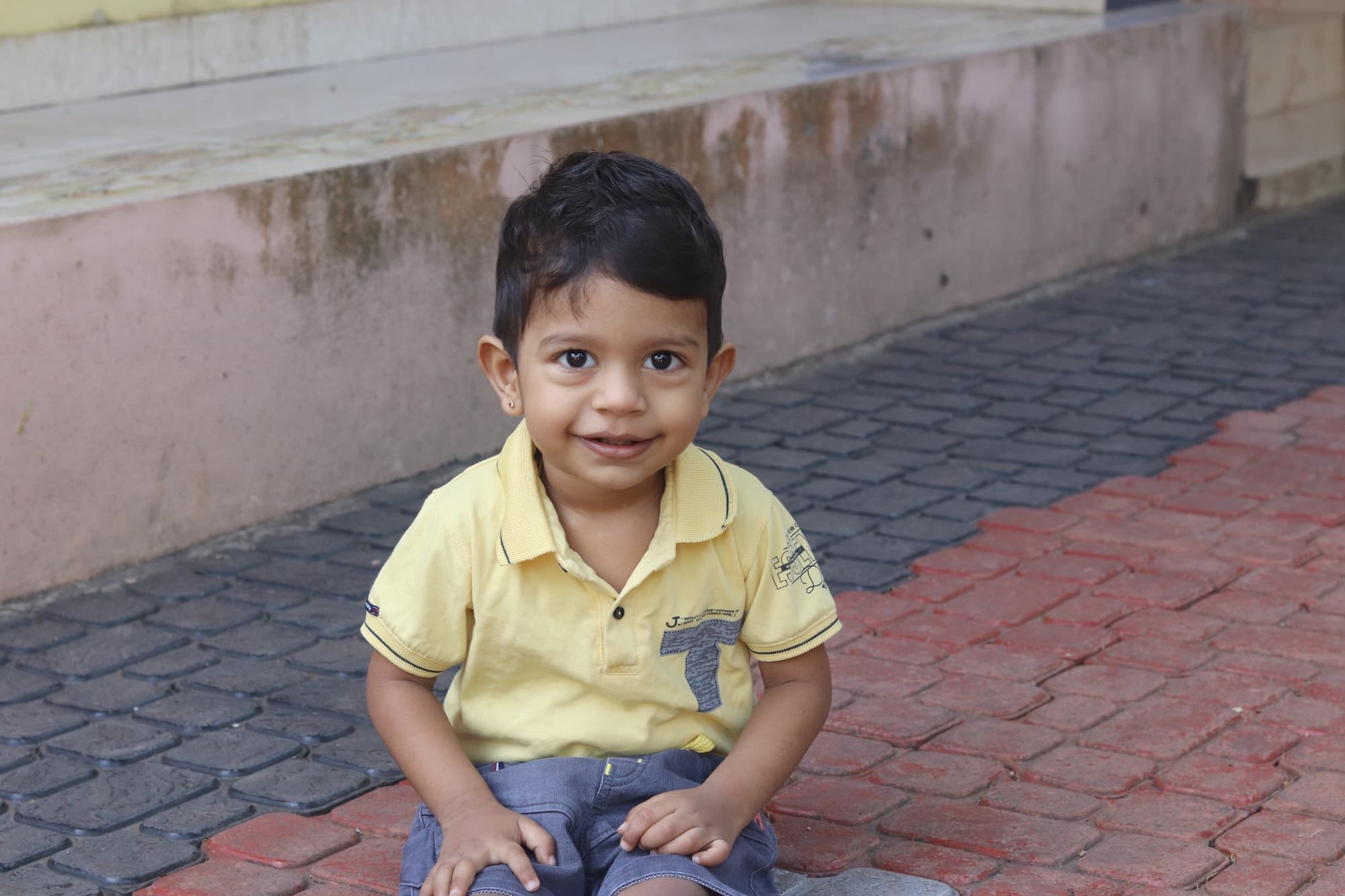 A child smiling in the Tuskaè kids corner