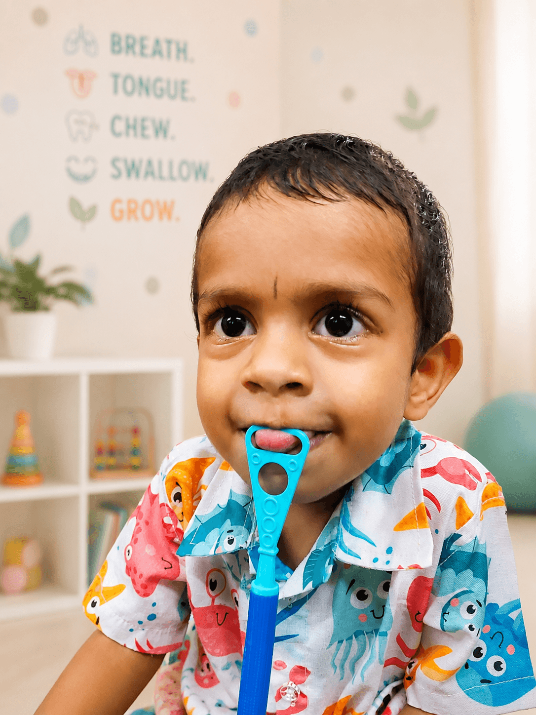 A toddler during a myofunctional therapy session at Tuskaè